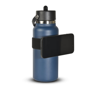 Magnetic phone holder fastened to bottle carrying a phone 